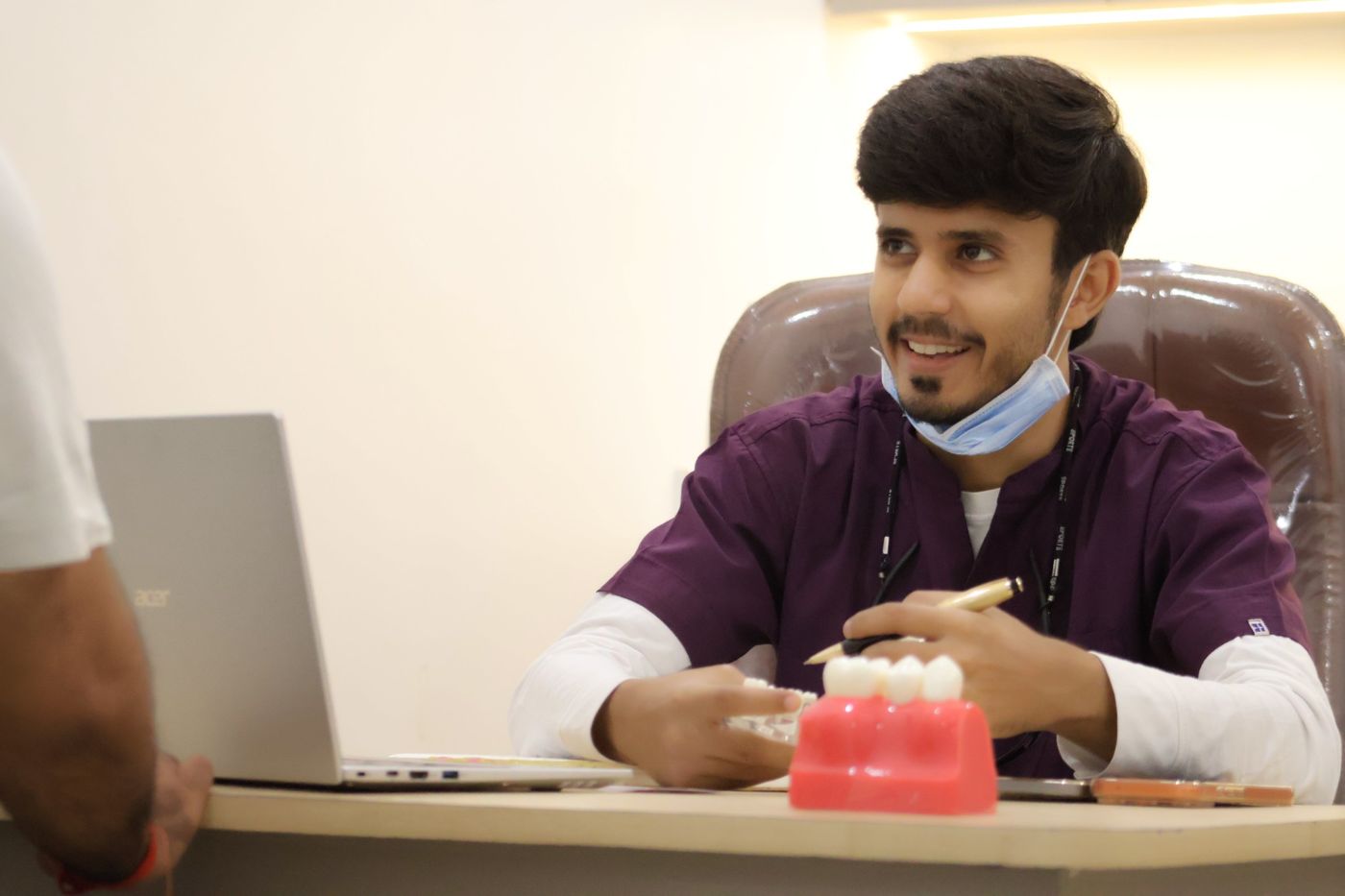 Dr. Abhishek Raj Singh explaining treatment to a patient